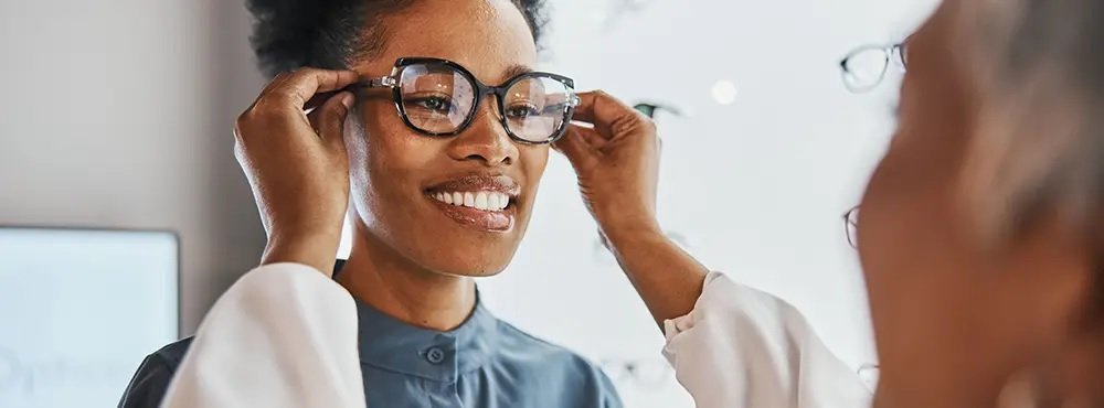 Patient trying on glasses at Tshidino Optometrist